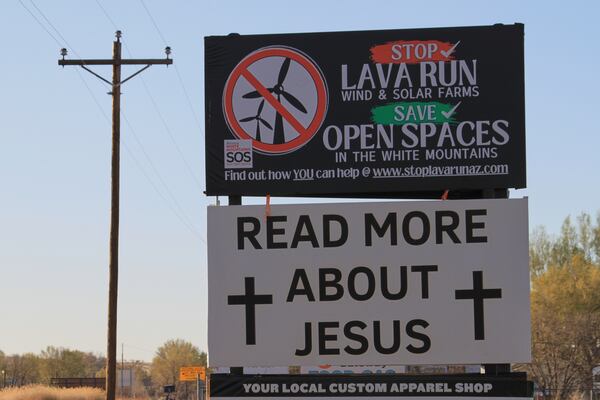 One of the billboards in opposition to an energy developer's plans for erecting more than 100 wind turbines across the grasslands and ancient lava fields is pictured just outside of Springerville, Ariz., Tuesday, April 22, 2025. (AP Photo/Susan Montoya Bryan)