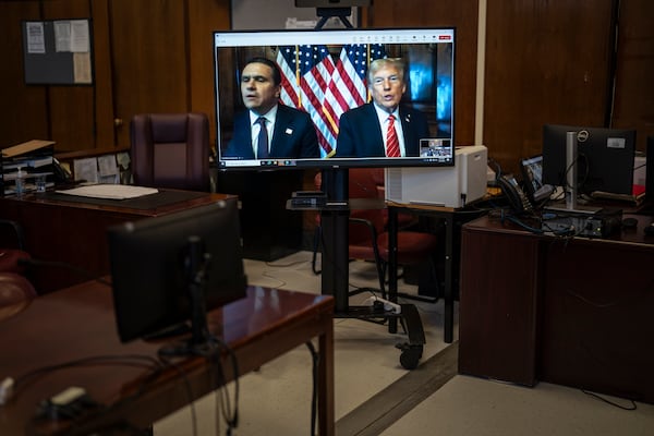 Attorney Todd Blanche and President-elect Donald Trump, seen on a television screen, appear virtually for sentencing for Trump's hush money conviction in a Manhattan courtroom on Friday, Jan. 10, 2025 in New York. (Jabin Botsford/The Washington Post via AP, Pool)