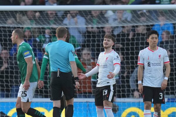 Liverpool's Harvey Elliott gestures after deflecting the ball with his hand in the penalty area during the English FA Cup fourth round soccer match between Plymouth Argyle and Liverpool at Home Park stadium in Plymouth, England, Sunday, Feb. 9, 2025. (AP Photo/Alastair Grant)