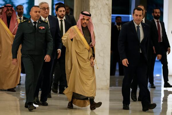 Saudi Arabia's Foreign Minister Prince Faisal bin Farhan al-Saud, center, waves to journalists upon his arrival to meet with Lebanese President Joseph Aoun at the presidential palace in Baabda, east of Beirut, Lebanon, Thursday, Jan. 23, 2025. (AP Photo/Hassan Ammar)