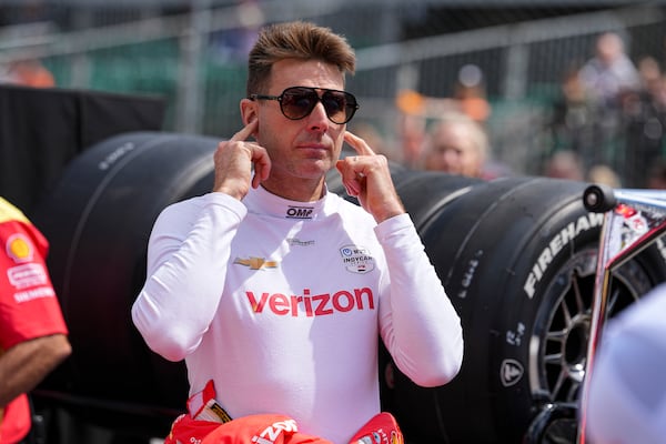 Will Power, of Australia, watches as he waits for is turn during qualification for the Indianapolis 500 auto race at Indianapolis Motor Speedway in Indianapolis, Saturday, May 17, 2025. (AP Photo/Michael Conroy)