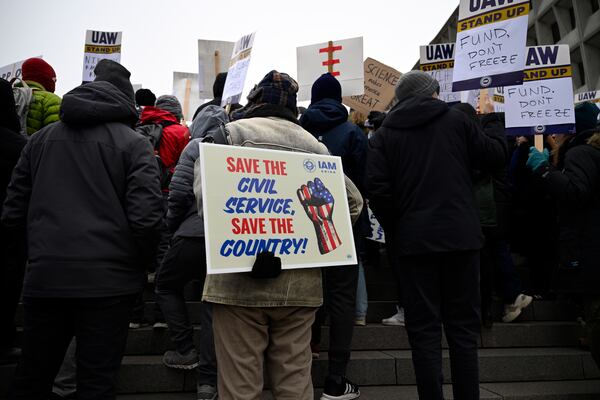 People rally at Health and Human Services headquarters to protest the polices of President Donald Trump and Elon Musk Wednesday, Feb. 19, 2025, in Washington. (AP Photo/John McDonnell)