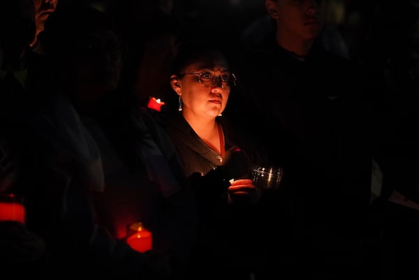 People attend a vigil for slain Native American teen Emily Pike in Mesa, Ariz., Thursday, March 6, 2025. (AP Photo/Samantha Chow)