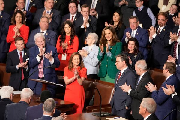 Rep. Lisa McClain, R-Mich., center left, and others applaud House Speaker Mike Johnson, R-La., as the House of Representatives meets to elect a speaker and convene the new 119th Congress at the Capitol in Washington, Friday, Jan. 3, 2025. (AP Photo/Mark Schiefelbein)