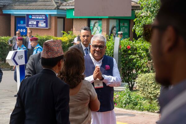 An Indian delegate arrives to participate in an environment conference named Sagarmatha Sambaad (Mount Everest Dialogue) in Kathmandu, Nepal, Friday, May 16, 2025. (AP Photo/Niranjan Shrestha)