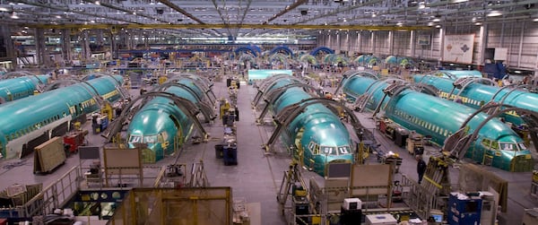 FILE - Boeing 737 fuselages are assembled at the Spirit AeroSystems facility in Wichita, Kan., on July 25, 2013. (AP Photo/The Wichita Eagle, Dave Williams, File)