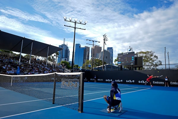 Bu Yunchaokete of China plays a backhand return to Hady Habib of Lebanon during their first round match at the Australian Open tennis championship in Melbourne, Australia, Sunday, Jan. 12, 2025. (AP Photo/Asanka Brendon Ratnayake)