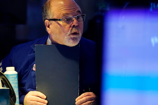 Specialist Douglas Johnson works on the floor of the New York Stock Exchange, Tuesday, Feb. 4, 2025. (AP Photo/Richard Drew)