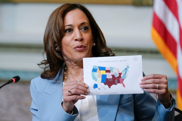 FILE - Vice President Kamala Harris displays a map showing abortion access by state as she speaks during the first meeting of the interagency Task Force on Reproductive Healthcare Access in the Indian Treaty Room in the Eisenhower Executive Office Building on the White House Campus in Washington, Aug. 3, 2022. (AP Photo/Susan Walsh, File)