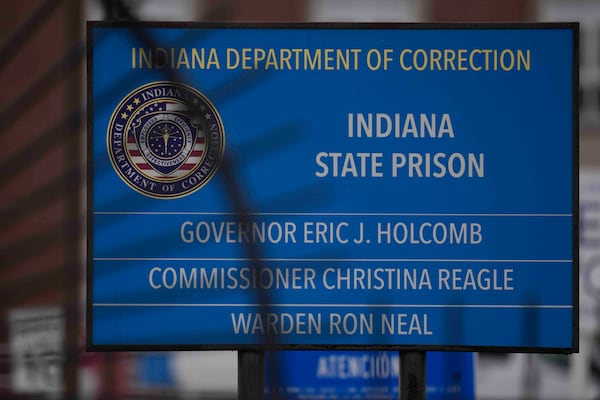 A sign is posted outside of Indiana State Prison where, barring last-minute court action or intervention by Gov. Eric Holcomb, Joseph Corcoran, 49, convicted in the 1997 killings of his brother and three other people, is scheduled to be put to death by lethal injection before sunrise Tuesday, Dec. 17, 2024, in Michigan City, Ind. (AP Photo/Erin Hooley)