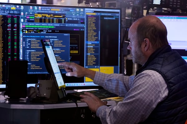 Trader Peter Mancuso works on the floor of the New York Stock Exchange, Tuesday, Feb. 4, 2025. (AP Photo/Richard Drew)