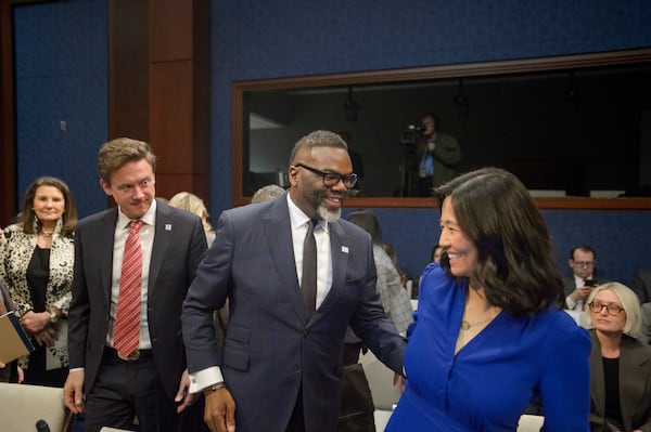 Denver Mayor Mike Johnston, left, Chicago Mayor Brandon Johnson, center, and Boston Mayor Michelle Wu, right, arrive for a House Committee on Oversight and Government Reform hearing with Sanctuary City Mayors on Capitol Hill, Wednesday, March 5, 2025, in Washington. (AP Photo/Rod Lamkey, Jr.)