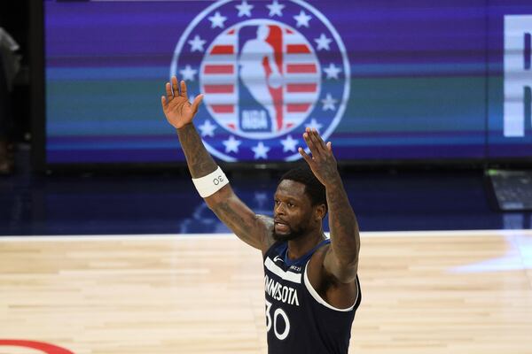 Minnesota Timberwolves forward Julius Randle (30) reacts during the second half of Game 3 of the Western Conference finals of the NBA basketball playoffs against the Oklahoma City Thunder, Saturday, May 24, 2025, in Minneapolis. (AP Photo/Matt Krohn)