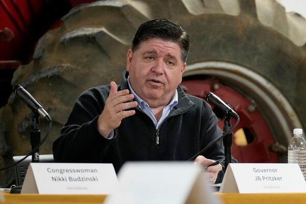 Illinois Gov. JB Pritzker talks during a roundtable discussion on impacts of the Trump Administration's actions on climate-smart agriculture and local farm economy at Sola Gratia Farm in Urbana, Ill., Wednesday, March 19, 2025. (AP Photo/Nam Y. Huh)