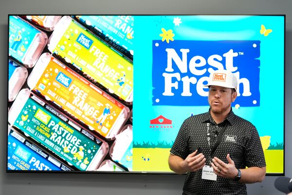 NestFresh executive vice president Jasen Urena speaks about the CHEGGY machine, an SUV-sized machine that can separate eggs by sex, before a demonstration at the Hy-Line hatchery, Tuesday, Dec. 10, 2024, in Wilton, Iowa. (AP Photo/Charlie Neibergall)