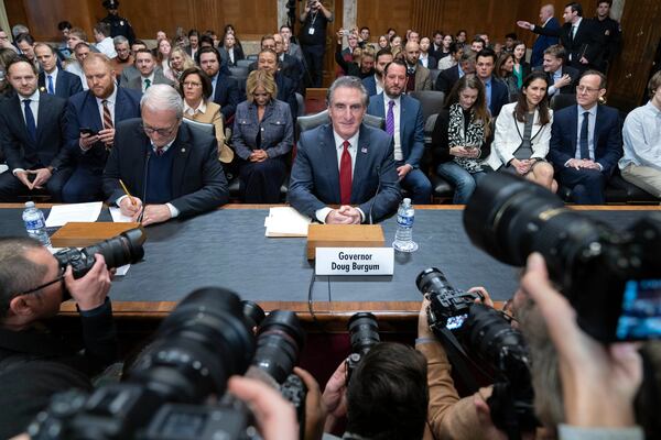 Former Gov. Doug Burgum, President-elect Donald Trump's choice to lead the the Interior Department as Secretary of the Interior, arrives to testify before the Senate Energy and Natural Resources Committee on Capitol Hill in Washington, Thursday, Jan. 16, 2025. (AP Photo/Jose Luis Magana)