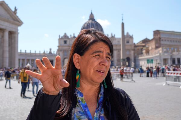 Peruvian investigative journalist Paola Margot Ugaz Cruz talks with the Associated Press near St. Peter's Square at the Vatican, Monday, May 19, 2025. (AP Photo/Gregorio Borgia)