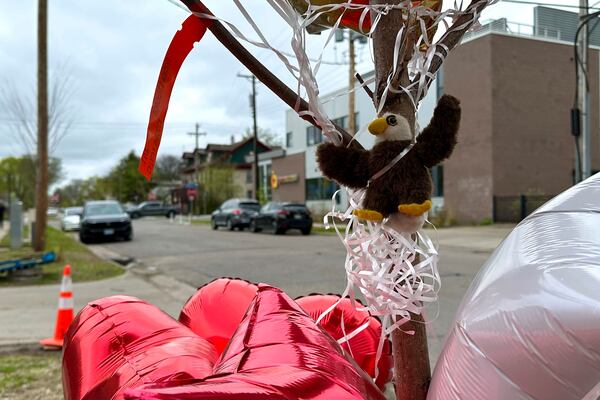 Items are placed as a memorial at the site of a late Tuesday fatal shooting, on Friday, May 2, 2025 in Minneapolis. (AP Photo/Mark Vancleave)