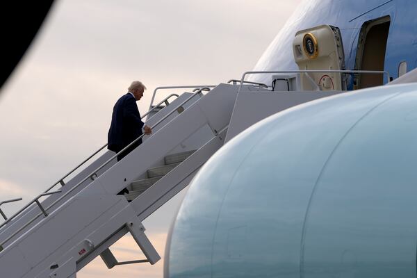 President Donald Trump boards Air Force One en route to Florida at Harry Reid International Airport in Las Vegas, Saturday, Jan. 25, 2025. (AP Photo/Mark Schiefelbein)