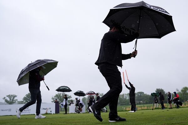 Rory McIlroy, right, of Northern Ireland, and Justin Thomas walk on the 14th hole during the second round of the Truist Championship golf tournament at the Philadelphia Cricket Club, Friday, May 9, 2025, in Flourtown. (AP Photo/Matt Rourke)