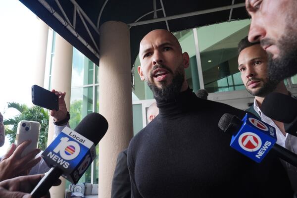 Influencer brothers Andrew and Tristan Tate arrive , Thursday, Feb. 27, 2025, in Fort Lauderdale, Fla. The brothers were charged with human trafficking in Romania and arrived in the U.S. after authorities lifted travel restrictions.(AP Photo/Marta Lavandier)