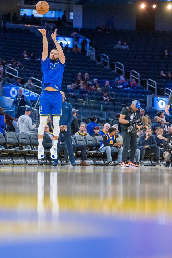 Golden State Warriors guard Stephen Curry warms up before an NBA basketball game against the Portland Trail Blazers in San Francisco, Monday, March 10, 2025. (AP Photo/Nic Coury)