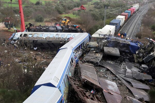 FILE - A crane, firefighters and rescuers operate after a collision, that killed 57 people, in Tempe, about 376 kilometres (235 miles) north of Athens, near Larissa city, Greece, Wednesday, March 1, 2023. (AP Photo/Vaggelis Kousioras, File)