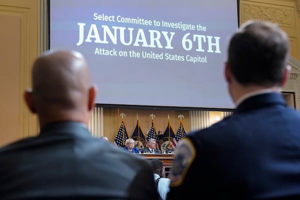 FILE - U.S. Capitol Police Sgt. Aquilino Gonell, left, and Washington Metropolitan Police Department officer Daniel Hodges listen as the House select committee investigating the Jan. 6 attack on the U.S. Capitol holds a hearing on Capitol Hill in Washington, Oct. 13, 2022. (AP Photo/Jacquelyn Martin, File)