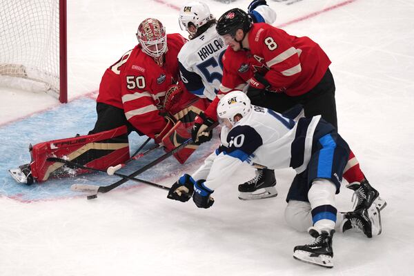 Canada's Cale Makar (8) tries to clear the puck away from Finland's Joel Armia (40) during the second period of a 4 Nations Face-Off hockey game, Monday, Feb. 17, 2025, in Boston. (AP Photo/Charles Krupa)