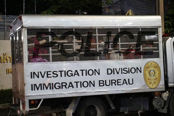 This photo provided by Thailand's daily web newspaper Prachatai shows a vehicle with a load of unidentified passengers leave the detention center in Bangkok, Thailand Thursday, Feb. 27, 2025.(Nuttaphol Meksobhon/Prachatai via AP)