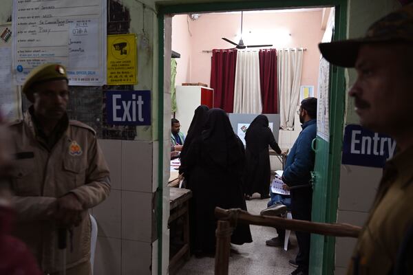 Muslim women casting their votes for Delhi state election at a polling booth in New Delhi, India, Wednesday, Feb.5, 2025. (AP Photo)