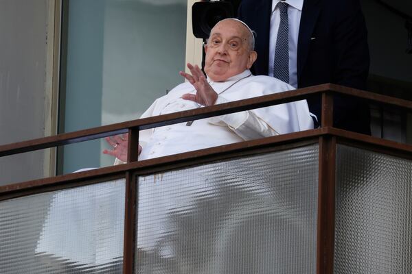 Pope Francis appears at a window of the Agostino Gemelli Polyclinic in Rome, Sunday, March 23, 2025, where he has been treated for bronchitis and bilateral pneumonia since Feb. 14. (AP Photo/Riccardo De Luca)