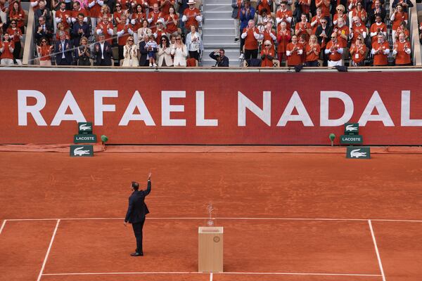 Rafa Nadal waves to the crowd during a farewell ceremony at center court Philippe-Chatrier, at the Roland-Garros stadium, in Paris, Sunday May 25, 2025 (AP Photo/Thibault Camus)