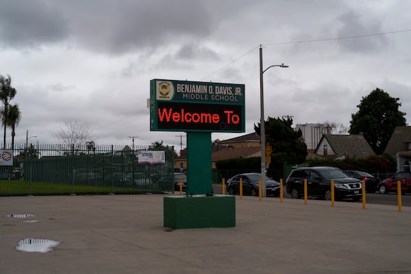 A sign is seen in front of Benjamin O. Davis Middle School in Compton, Calif., Thursday, Feb. 6, 2025. (AP Photo/Eric Thayer)