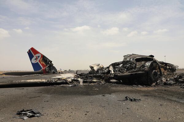 Yemenis inspect wreckage of a destroyed civilian aircraft following Israeli airstrikes on Sanaa International Airport in Sanaa, Yemen, Wednesday, May 7, 2025. (AP Photo/Osamah Abdulrahman)