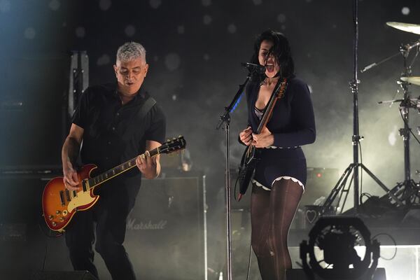 St. Vincent, right, performs with Pat Smear of Nirvana during the FireAid benefit concert on Thursday, Jan. 30, 2025, at The Forum in Inglewood, Calif. (AP Photo/Chris Pizzello)