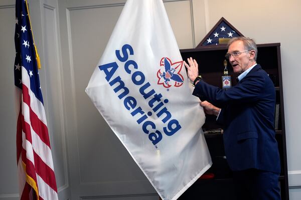 Roger Krone, chief executive officer of Scouting America, describes the design of the organization's flag in Irving, Texas, Wednesday, Feb. 5, 2025. (AP Photo/LM Otero)