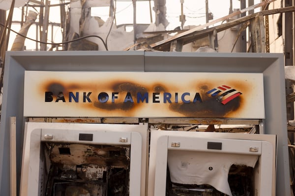 An ATM is damaged at a Bank of America branch after the Palisades Fire swept through in the Pacific Palisades neighborhood of Los Angeles, Wednesday, Jan. 8, 2025. (AP Photo/Etienne Laurent)