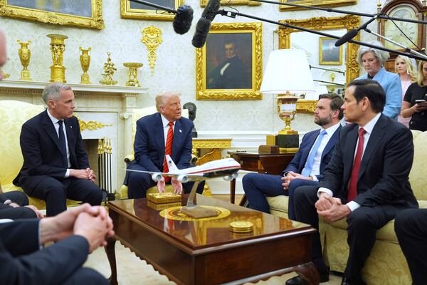 President Donald Trump meets Canadian Prime Minister Mark Carney in the Oval Office of the White House, Tuesday, May 6, 2025, in Washington. (AP Photo/Evan Vucci)