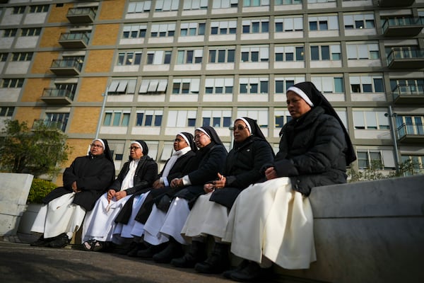 Nuns pray for Pope Francis in front of the Agostino Gemelli Polyclinic, in Rome, Thursday, Feb. 27, 2025, where Pope Francis is hospitalized since Friday, Feb. 14. (AP Photo/Andrew Medichini)