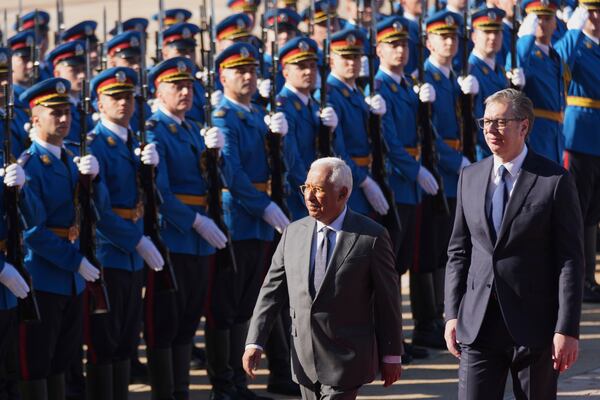 European Council President Antonio Costa, left, reviews an honor guard with Serbian President Aleksandar Vucic during a welcome ceremony at the Serbia Palace in Belgrade, Serbia, Tuesday, May 13, 2025. (AP Photo/Darko Vojinovic)