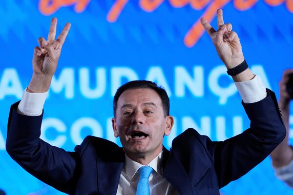 Incumbent Prime Minister and leader of the center-right Social Democratic Party Luis Montenegro gestures while addressing his supporters following Portugal's general election, in Lisbon, Monday, May 19, 2025. (AP Photo/Armando Franca)