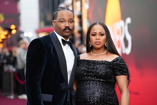 Director Ryan Coogler, left, and Zinzi Coogler pose for photographers upon arrival at the premiere of the film 'Sinners' on Monday, April 14, 2025, in London. (Photo by Scott A Garfitt/Invision/AP)