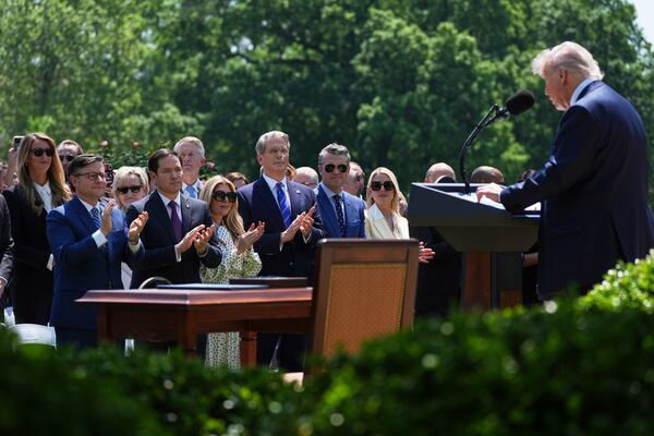 President Donald Trump speaks as House Speaker Mike Johnson, R-La., from front row left, Secretary of State Marco Rubio, and from front row right, Attorney General Pam Bondi, Defense Secretary Pete Hegseth and Treasury Secretary Scott Bessent listen during a National Day of Prayer event in the Rose Garden of the White House, Thursday, May 1, 2025, in Washington. (AP Photo/Evan Vucci)