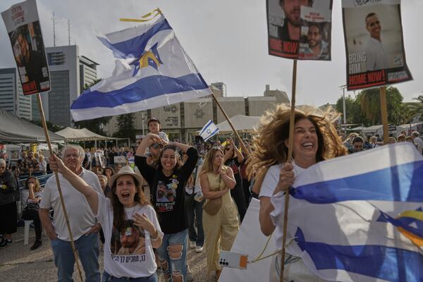 People react as they gather to watch a live broadcast of Israeli-American soldier Edan Alexander to be released from Hamas captivity in Gaza, at a plaza known as the hostages square in Tel Aviv, Monday, May 12, 2025. Alexander was abducted during the Hamas-led attack on his base on October 7, 2023. (AP Photo/Oded Balilty)
