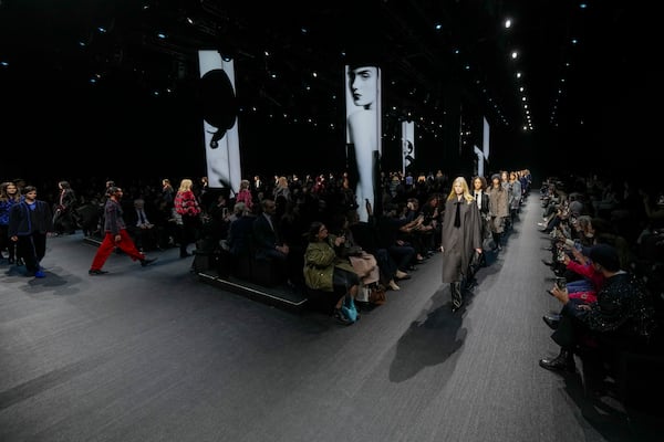 Models wear creations as part of the Emporio Armani Fall/Winter 2025-2026 Womenswear collection presented in Milan, Italy, Thursday, Feb. 27, 2025. (AP Photo/Luca Bruno)