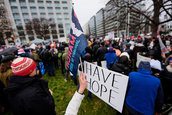 A person holds a sign reading, "Have Hope," in Farragut Square before the start of the People's March, Saturday, Jan. 18, 2025, in Washington. (AP Photo/Mike Stewart)