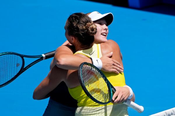 Aryna Sabalenka, right, of Belarus is congratulated by Mirra Andreeva of Russia after their fourth round match at the Australian Open tennis championship in Melbourne, Australia, Sunday, Jan. 19, 2025. (AP Photo/Asanka Brendon Ratnayake)