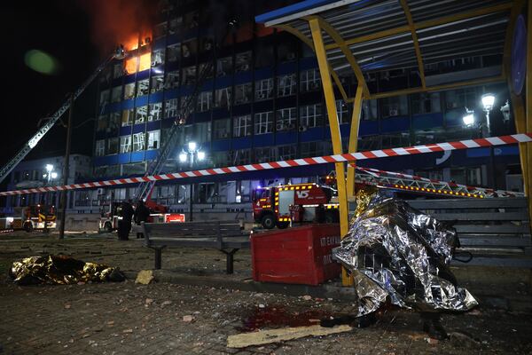 Dead bodies of people killed in a Russian airstrike are seen at a tram station in Zaporizhzhia, Ukraine, Wednesday Jan. 8, 2025. (AP Photo/Oleg Movchaniuk)