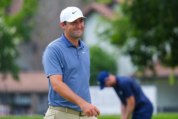 Scottie Scheffler reacts on the 14th hole during the first round of the Charles Schwab Challenge golf tournament at Colonial Country Club in Fort Worth, Texas, Thursday, May 22, 2025. (AP Photo/LM Otero)